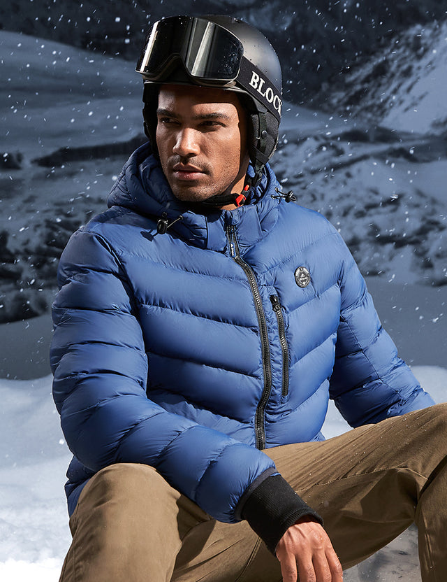 Model Wearing Blue Heated Puffer Jacket While Skiing Outdoors