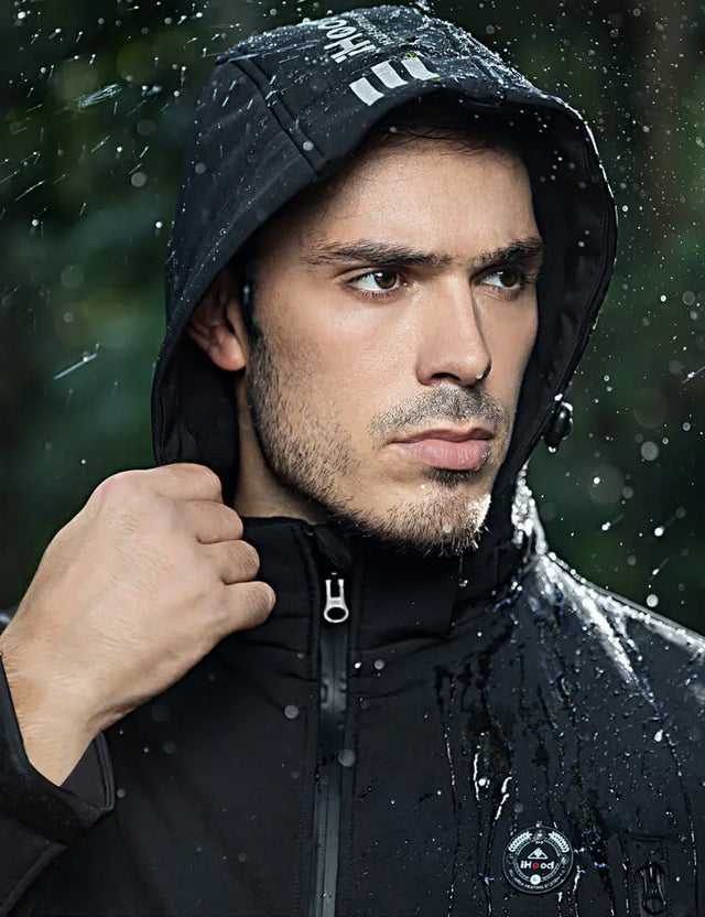 Waterproof detail image of a black heated jacket, highlighting protection against the elements.