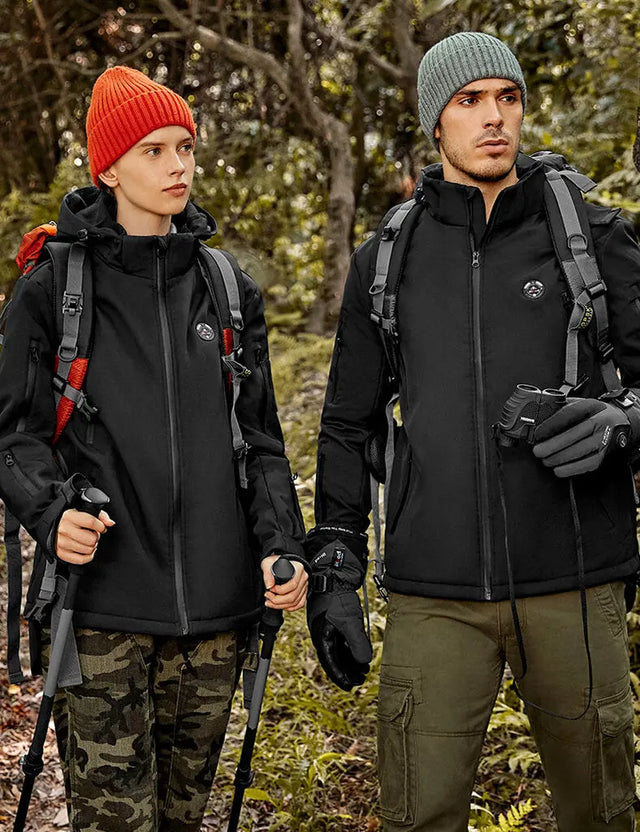 Model in a black heated jacket while hunting outdoors, combining style with practicality in cold environments.