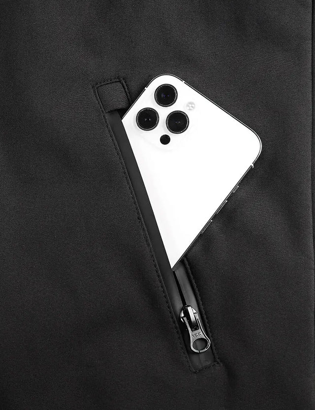Detail shot of pocket on a black heated jacket, designed for convenience and functionality during outdoor activities.