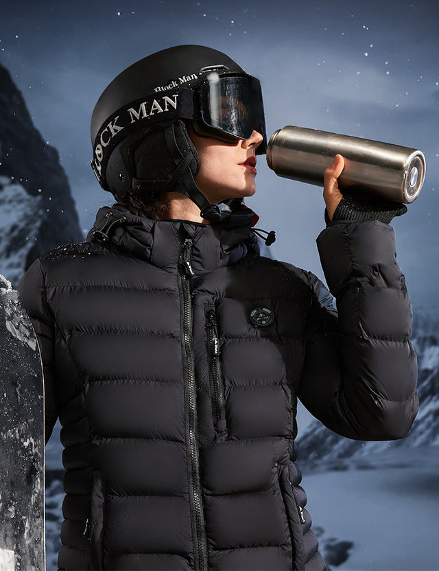 Model Wearing Black Heated Puffer Jacket While Skiing Outdoors