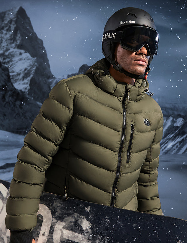 Model Wearing Green Heated Puffer Jacket While Skiing Outdoors