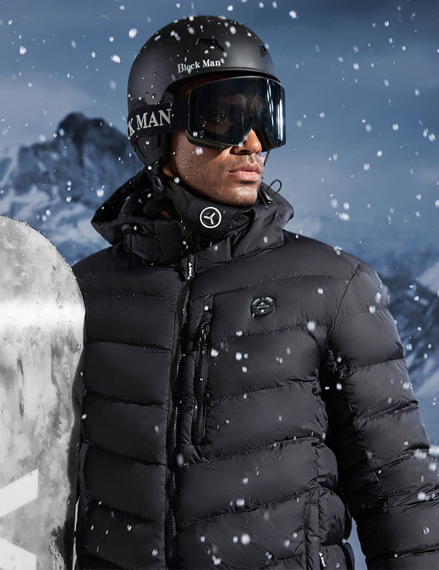 Model Wearing Black Heated Puffer Jacket While Skiing Outdoors