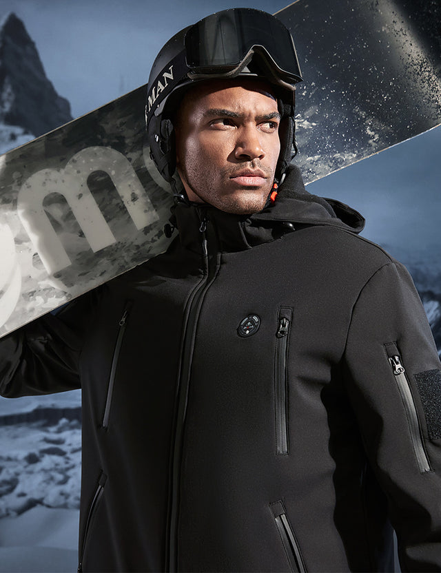 Model wearing a black heated jacket outdoors, demonstrating its suitability for cold weather conditions.