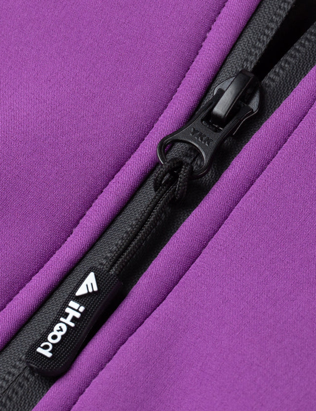 Detailed view of the zipper on the purple women's heated jacket, showcasing its robust construction.