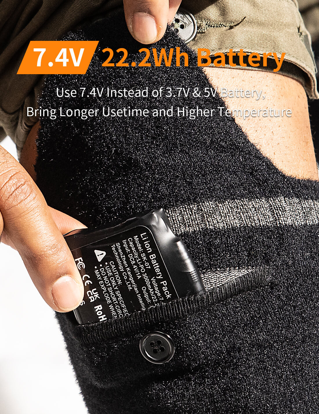 Close-up of the 7.4V rechargeable battery in black heated socks.
